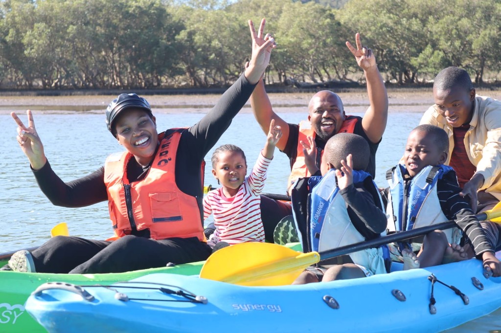 Family kayaking on the water
